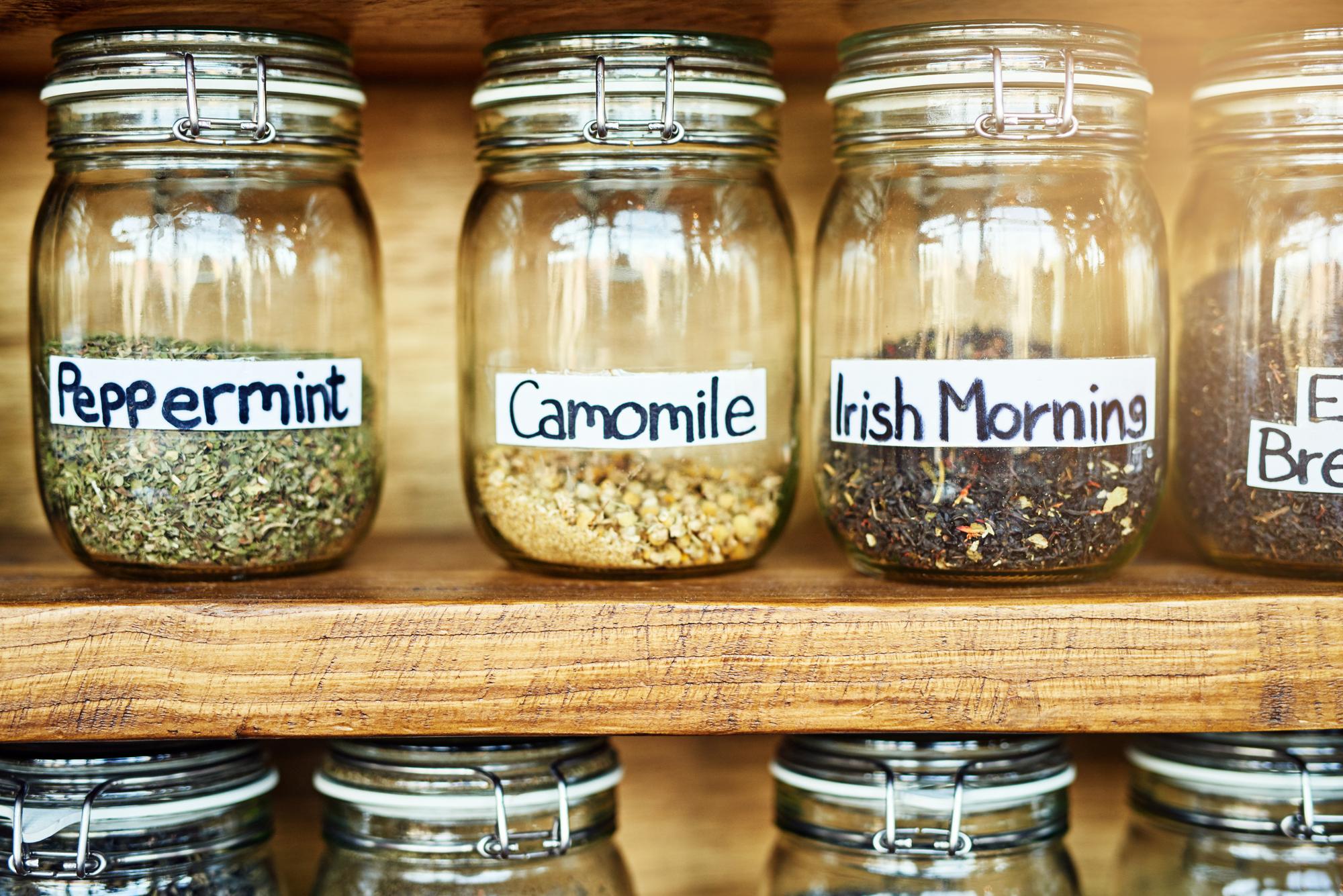 Close-up of labeled jars and ingredient scale